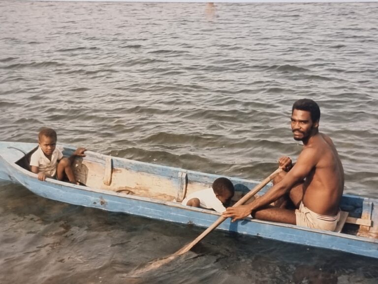 Freediver Dave Bowman in his dory with his 2 sons, 1986