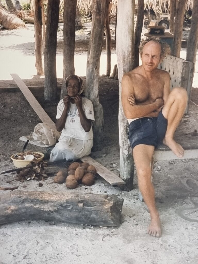The unforgettable German Man (Adolf Ulrich) with his wife Wida Alvanzer chipping her copra to make oil at their house in Bentley Bay, late 80’s